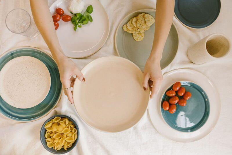 Lafayette Avenue Ceramics tablescape of handmade ceramic pieces in various colors