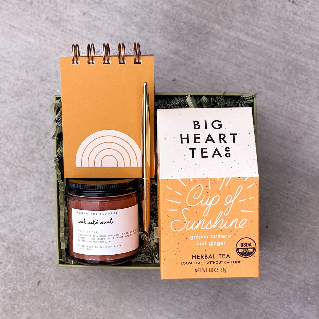 Little sunshine gift box with tea, scrub, notebook and pen